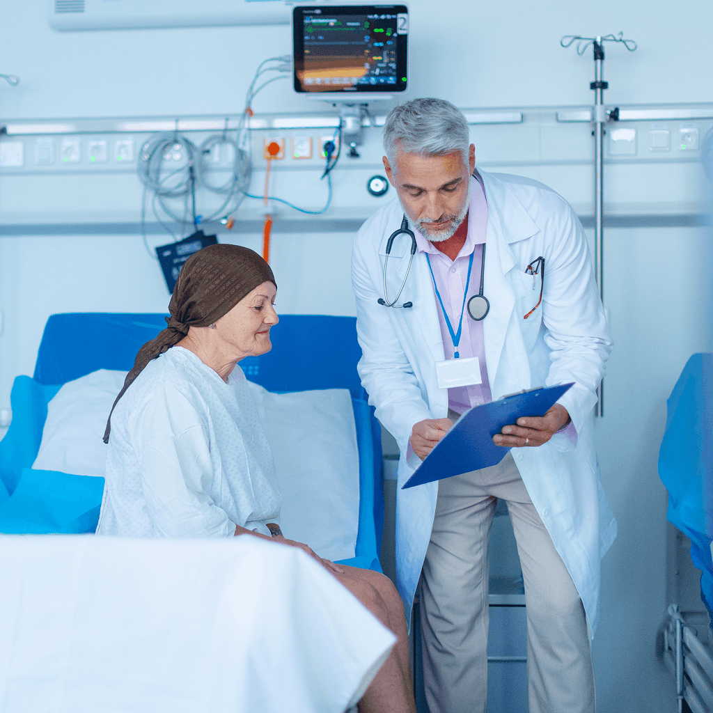 doctor meeting with patient in hospital room