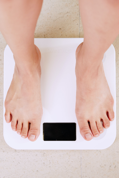 A person's feet on a weighing machine