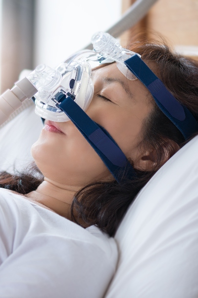 A woman sleeping on a hospital bed